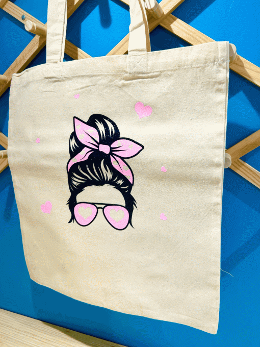 Tête femme noeud rose