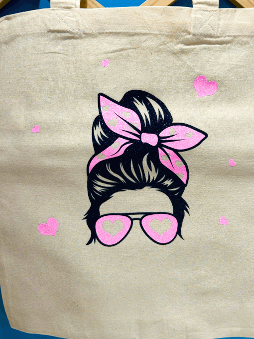 Tête femme noeud rose